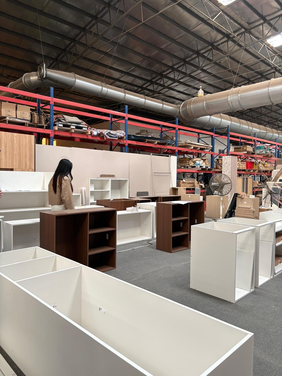 Assembled closet cabinets staged for a factory quality check